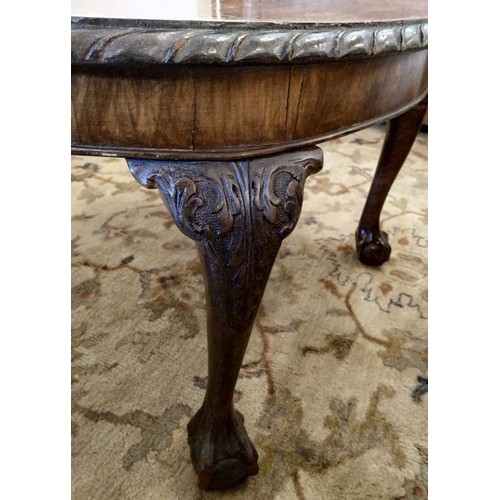 572 - LOW TABLE, George III style, oval top with pie crust border on cabriole legs with ball and claw feet... 