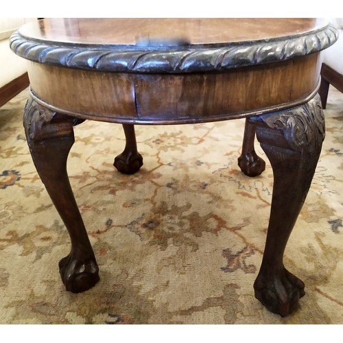 572 - LOW TABLE, George III style, oval top with pie crust border on cabriole legs with ball and claw feet... 