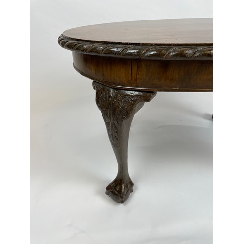 572 - LOW TABLE, George III style, oval top with pie crust border on cabriole legs with ball and claw feet... 