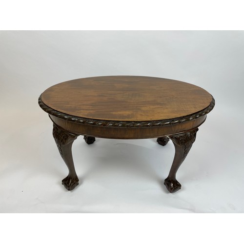 572 - LOW TABLE, George III style, oval top with pie crust border on cabriole legs with ball and claw feet... 