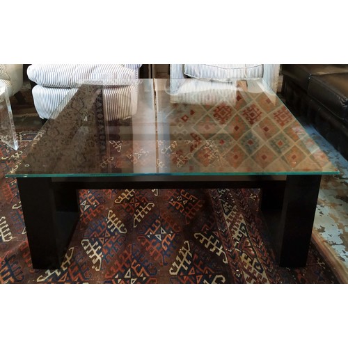 187 - LOW TABLE, 42cm H x 105cm W, ebonised with square glass top.