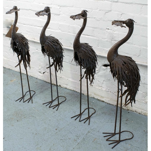 63 - CRANES, four, each 90cm tall metal. (4)