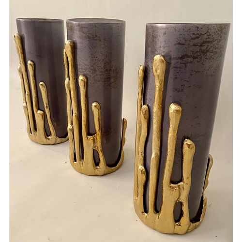 132 - CANDLE HOLDERS, three, Molten gilt metal detail, 32cm H. (3)