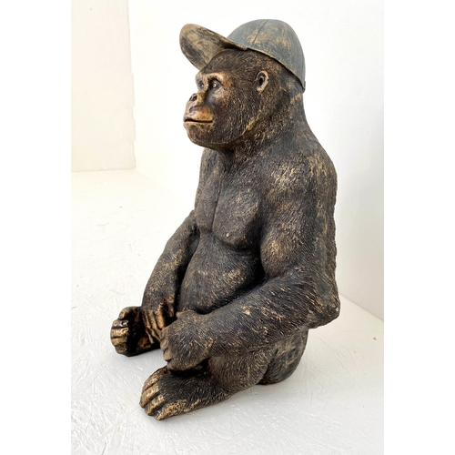 169 - GORILLA WEARING CAP, resin cast, 58cm x 40cm x 34cm.