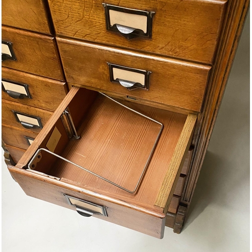 393 - FILING CHEST, late 19th/early 20th century oak having two banks of ten drawers, 131cm x 79cm x 47cm.