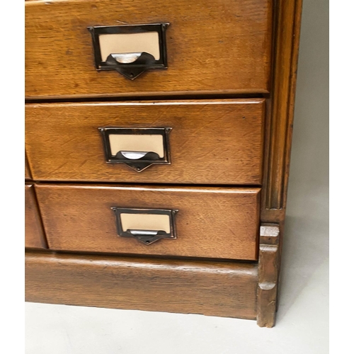 393 - FILING CHEST, late 19th/early 20th century oak having two banks of ten drawers, 131cm x 79cm x 47cm.