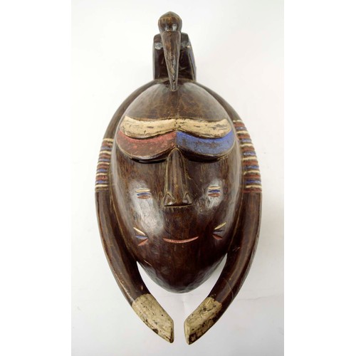 377 - BAOULE MASK, carved and painted wood, blue, red, white, Ivory Coast, 45cm x 24cm.