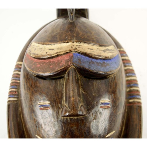 377 - BAOULE MASK, carved and painted wood, blue, red, white, Ivory Coast, 45cm x 24cm.