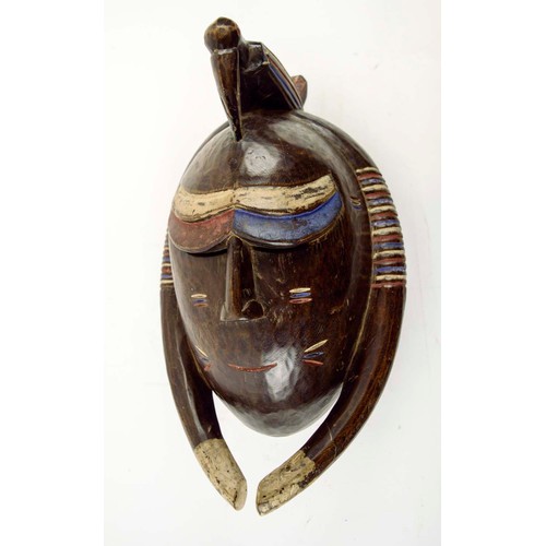 377 - BAOULE MASK, carved and painted wood, blue, red, white, Ivory Coast, 45cm x 24cm.