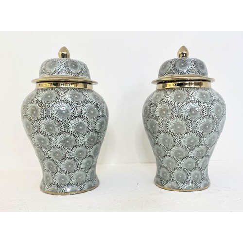 105 - TEMPLE JARS, a pair, 43cm H with covers. (2)