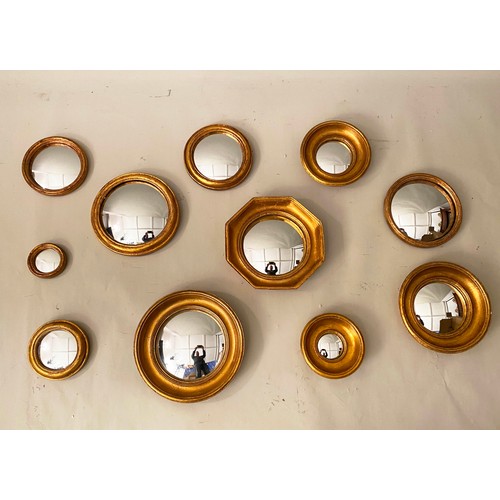 128 - CONVEX MIRRORS, a set of eleven, gilt frames, various sizes. (11)