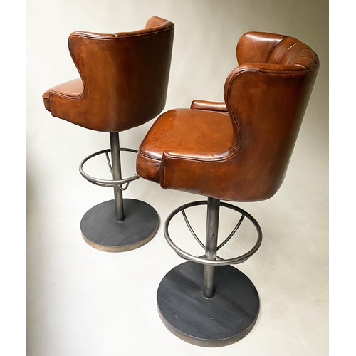 416 - BAR STOOLS, a pair, 116cm H, chair height 84cm, stitched tan leather, revolving on a steel base with... 