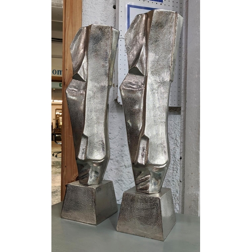 173 - MANNER OF MODIGLIANI SCULPTURES, on base nickel metal, 61cm x 16cm x 13cm.