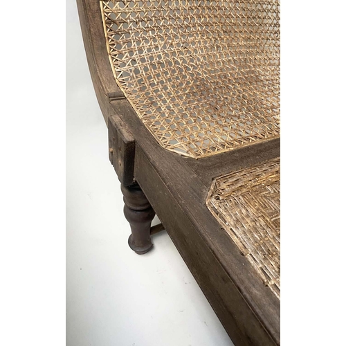 455 - ANGLO INDIAN DAYBED/CHAISE, late 19th/early 20th century, North Indian teak and cane panelled, with ... 
