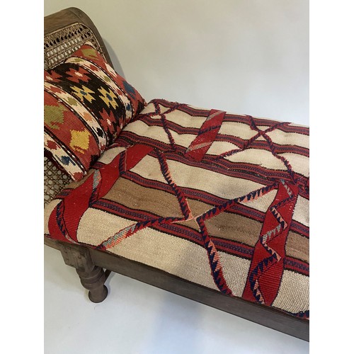 455 - ANGLO INDIAN DAYBED/CHAISE, late 19th/early 20th century, North Indian teak and cane panelled, with ... 