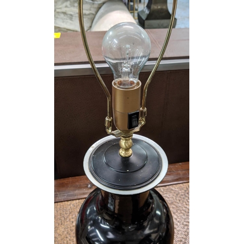 142 - TABLE LAMPS, a pair, black urn shaped, each 87cm H including shades. (2)