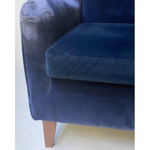 451 - WINGBACK ARMCHAIR, 1960's Danish style deep blue velvet upholstered, 85cm W.