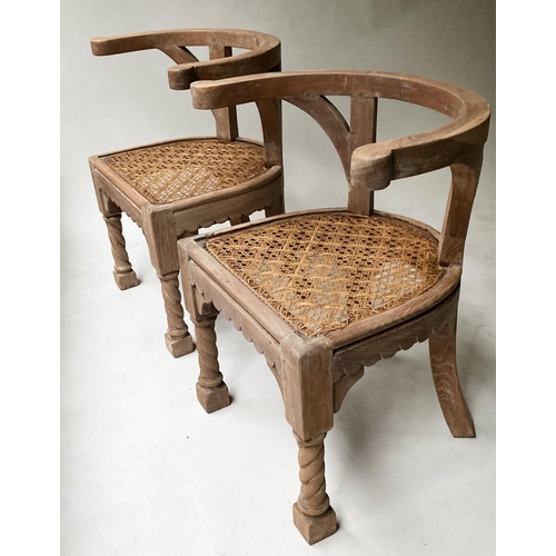 456 - ARMCHAIRS, a pair, 19th century Anglo colonial teak with arched backs and cane seats, 64cm W. (2)