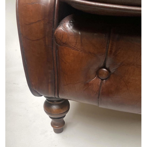 449 - CLUB ARMCHAIR, vintage buttoned brown leather with turned front supports, 76cm W.