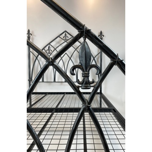 135 - DOUBLE BED FRAME, Gothic style with fleur-de-lis finals, 196cm L x 148cm H x 141cm W.