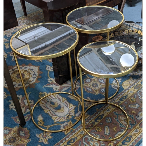 8 - SIDE TABLES, a set of three, 40cm diam x 66cm, gilt metal, mirror. (3)