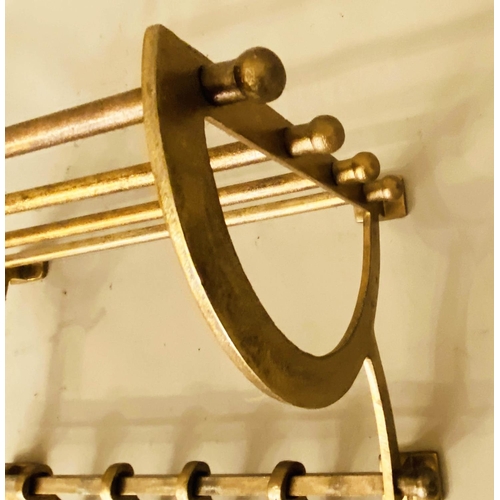 163 - WALL MOUNTING COAT RACKS,  a pair, 34cm x 46cm x 27cm, gilt metal. (2)