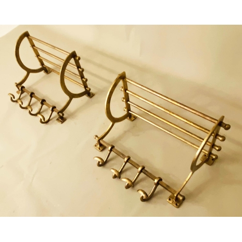 163 - WALL MOUNTING COAT RACKS,  a pair, 34cm x 46cm x 27cm, gilt metal. (2)