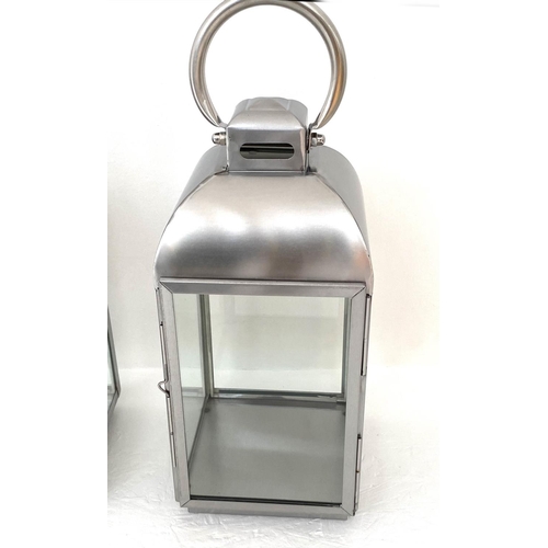 168 - STORM LANTERNS, a set of four, 45cm H, polished metal, glazed. (4)