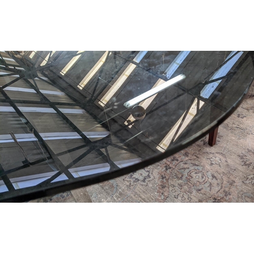 86 - DINING TABLE, 184cm diam x 72cm H, contemporary, polished metal base, smoked glass top.