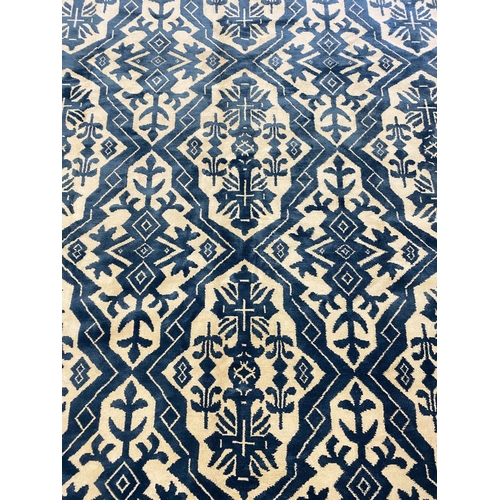 401 - LUKE IRWIN SILK AND WOOL CARPET, 270cm x 185cm.