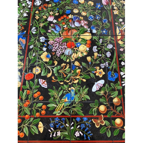 376 - LOW TABLE, 49cm H x 125cm x 85cm, Continental ceramic tiled top decorated with exotic flora and faun... 