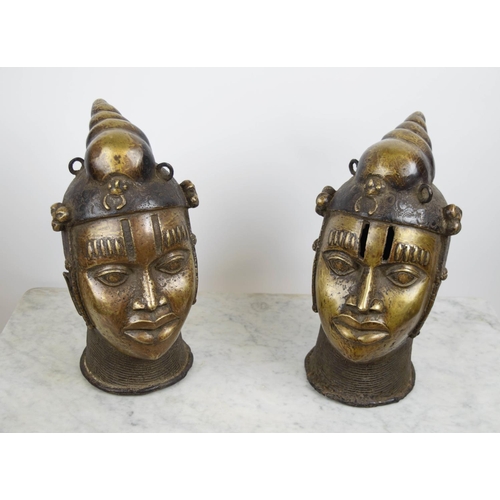 124 - BENIN OBA HEADS, a pair, bronze, 40cm H. (2)