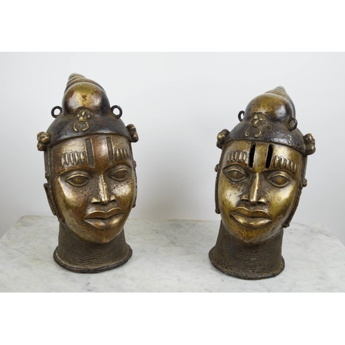 124 - BENIN OBA HEADS, a pair, bronze, 40cm H. (2)