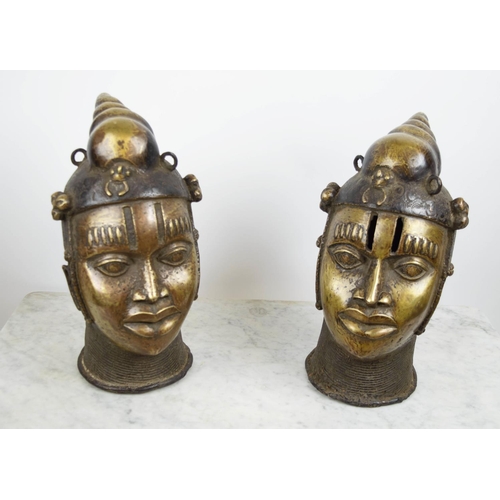 124 - BENIN OBA HEADS, a pair, bronze, 40cm H. (2)