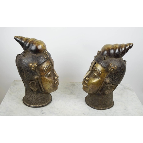 124 - BENIN OBA HEADS, a pair, bronze, 40cm H. (2)