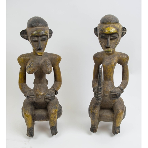 128 - SENOUFO STATUES, a pair, 60cm H, from the Ivory Coast. (2)