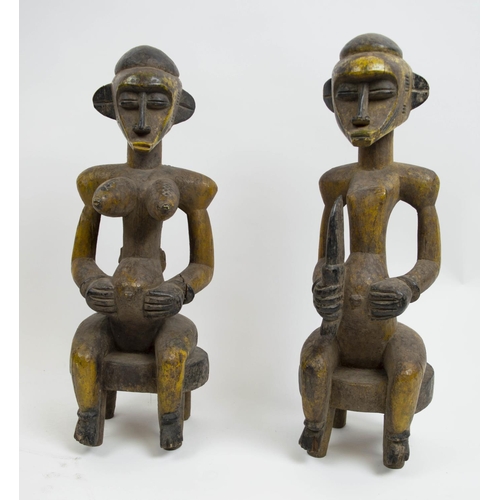 128 - SENOUFO STATUES, a pair, 60cm H, from the Ivory Coast. (2)