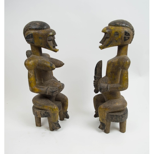 128 - SENOUFO STATUES, a pair, 60cm H, from the Ivory Coast. (2)