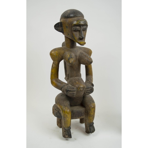 128 - SENOUFO STATUES, a pair, 60cm H, from the Ivory Coast. (2)