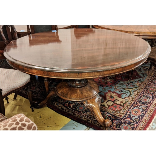 318 - BREAKFAST TABLE, 73cm H x 132cm diam, mid Victorian rosewood with circular tilt top on brass castors... 