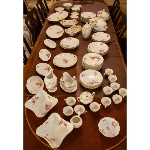 135 - PART DINNER SERVICE, comprising twelve hand painted foliate KPM soup bowls, nine dinner plates, two ... 