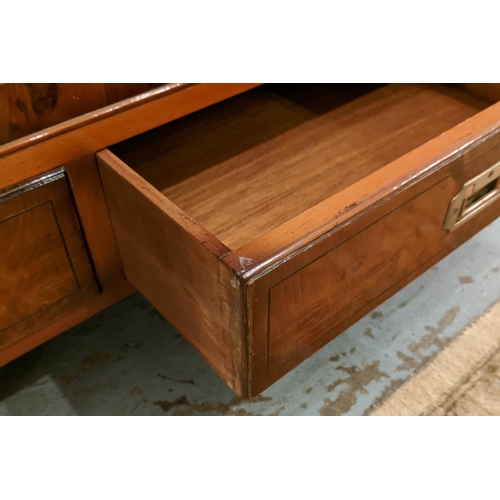 258 - CAMPAIGN STYLE COCKTAIL CABINET, yewwood with two leather panelled doors enclosing glass shelves and... 
