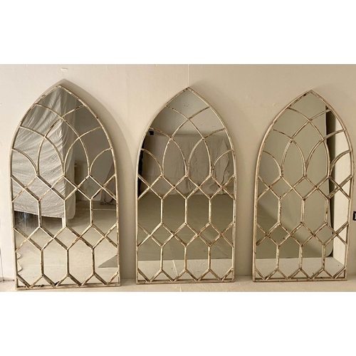 586 - ARCHITECTURAL WALL MIRRORS, a set of three, 132cm x 66cm, aged white painted finish. (3)