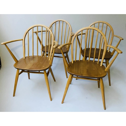 429 - ERCOL WINDSOR DINING CHAIRS, a set of four elm stick hoop back armchairs with solid seats (all label... 