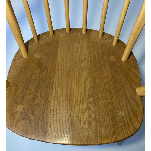 429 - ERCOL WINDSOR DINING CHAIRS, a set of four elm stick hoop back armchairs with solid seats (all label... 
