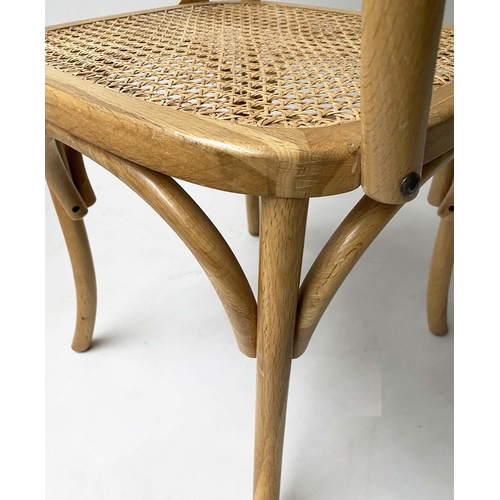 338 - DINING CHAIRS, a set of six, oak bentwood with X backs and cane seats including two with arms. (6)