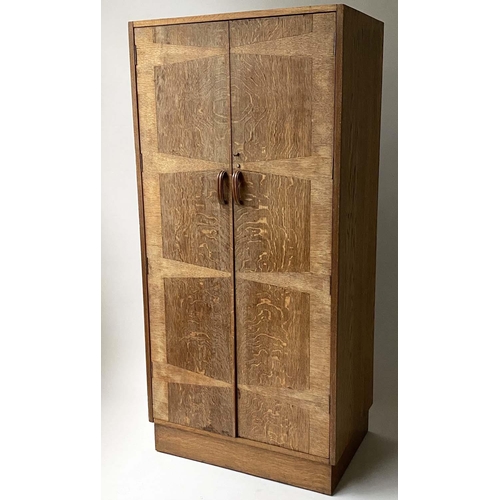 240 - HEALS WARDROBE, Art Deco period, oak and radial oak, with two panel doors enclosing divided hanging ... 