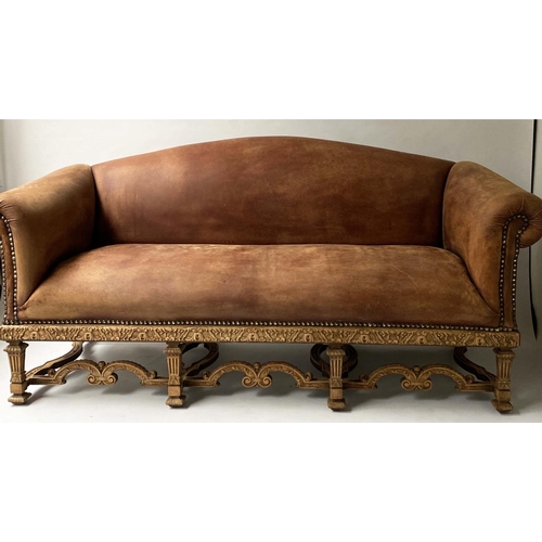 233 - SOFA, early 20th century, natural hide leather, brass studded, with arched back scroll arms and carv... 