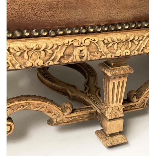 233 - SOFA, early 20th century, natural hide leather, brass studded, with arched back scroll arms and carv... 