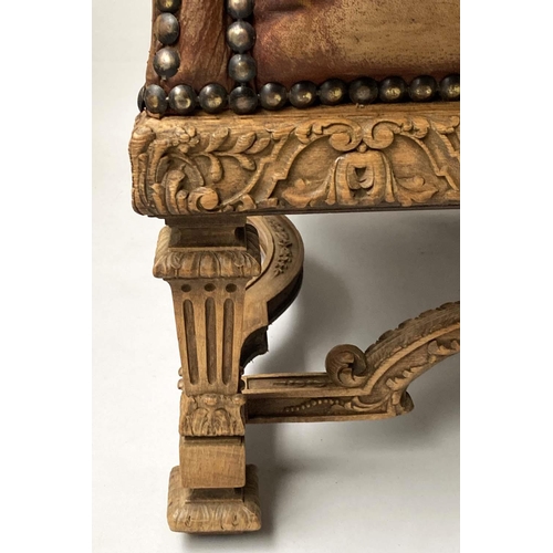 233 - SOFA, early 20th century, natural hide leather, brass studded, with arched back scroll arms and carv... 
